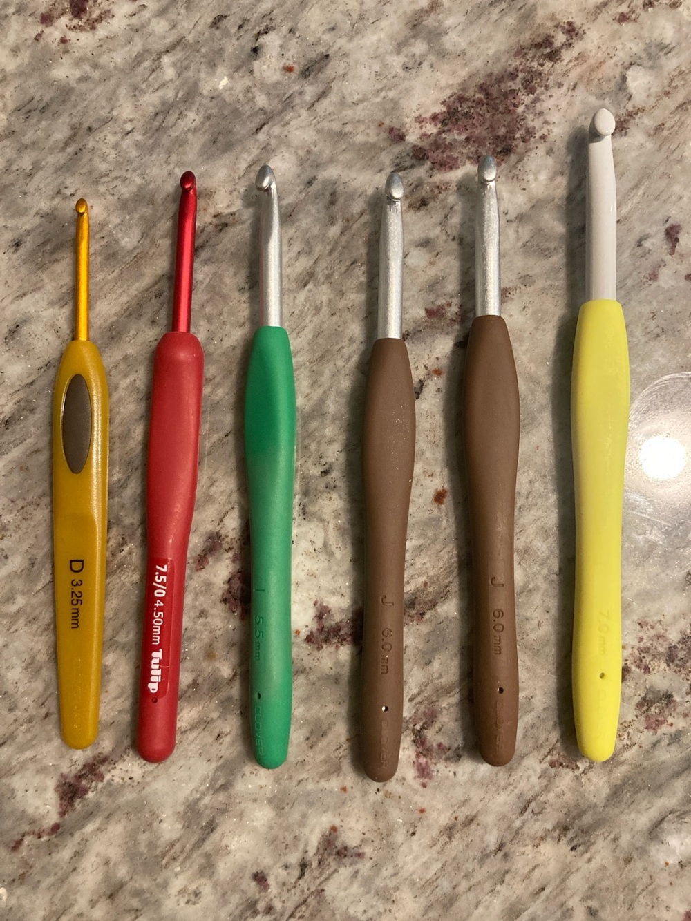 Set of 6 misc crochet hooks..clover and tulip etimo red